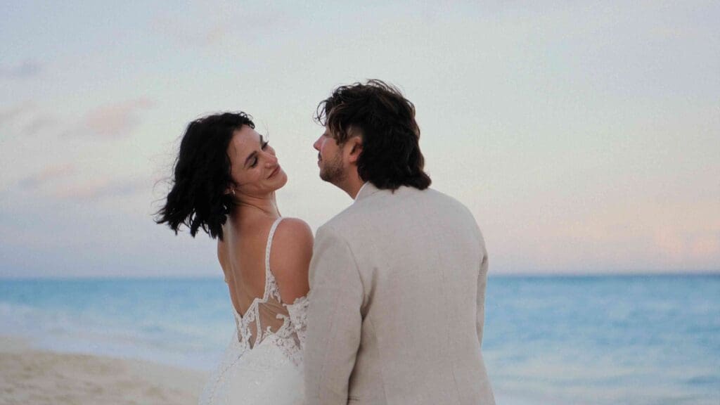 Couple laughing naturally on camera during their wedding film