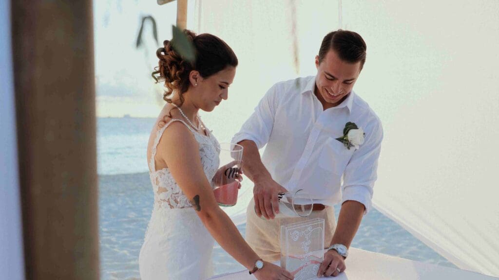 Sand blending ritual in a tropical destination wedding film